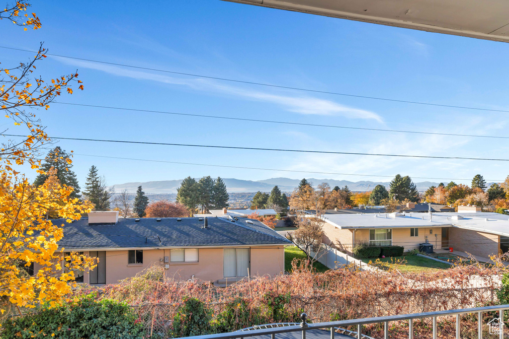 Rear view of property with a mountain view