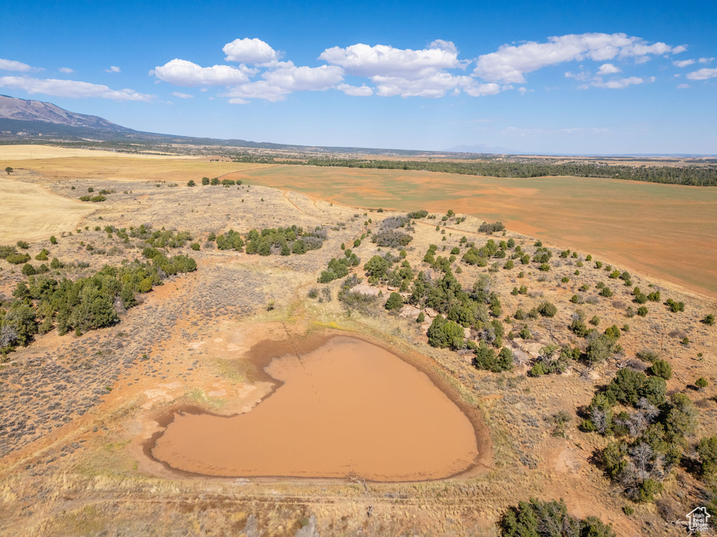 Aerial view featuring a water and mountain view