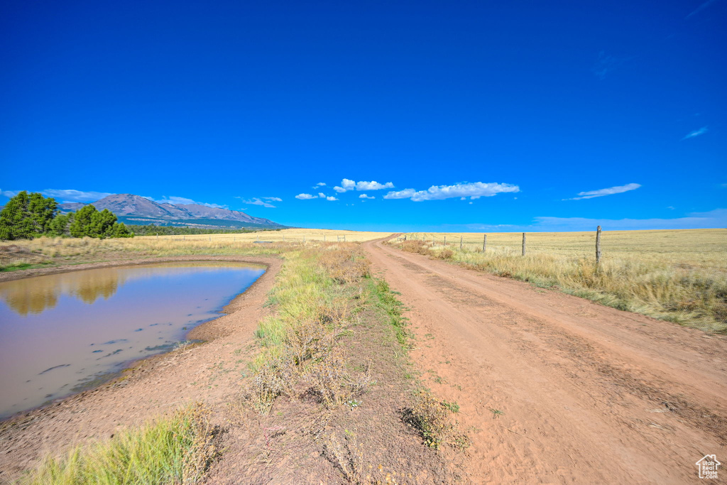 Water view featuring a mountain view and a rural view