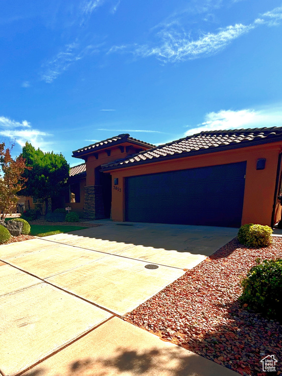 View of front of property with a garage