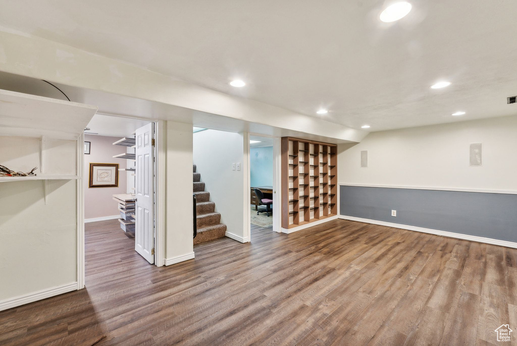 Basement with hardwood / wood-style floors