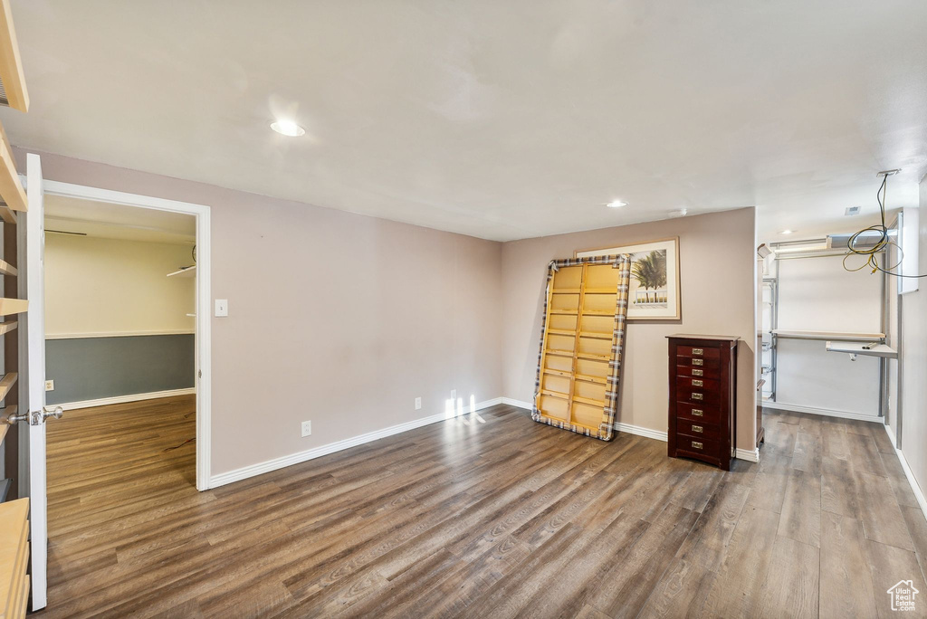 Unfurnished bedroom featuring wood-type flooring