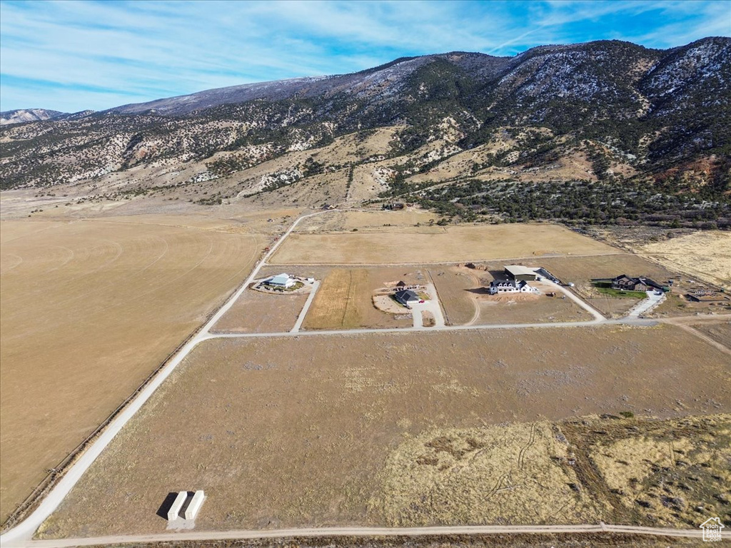 Birds eye view of property with a mountain view