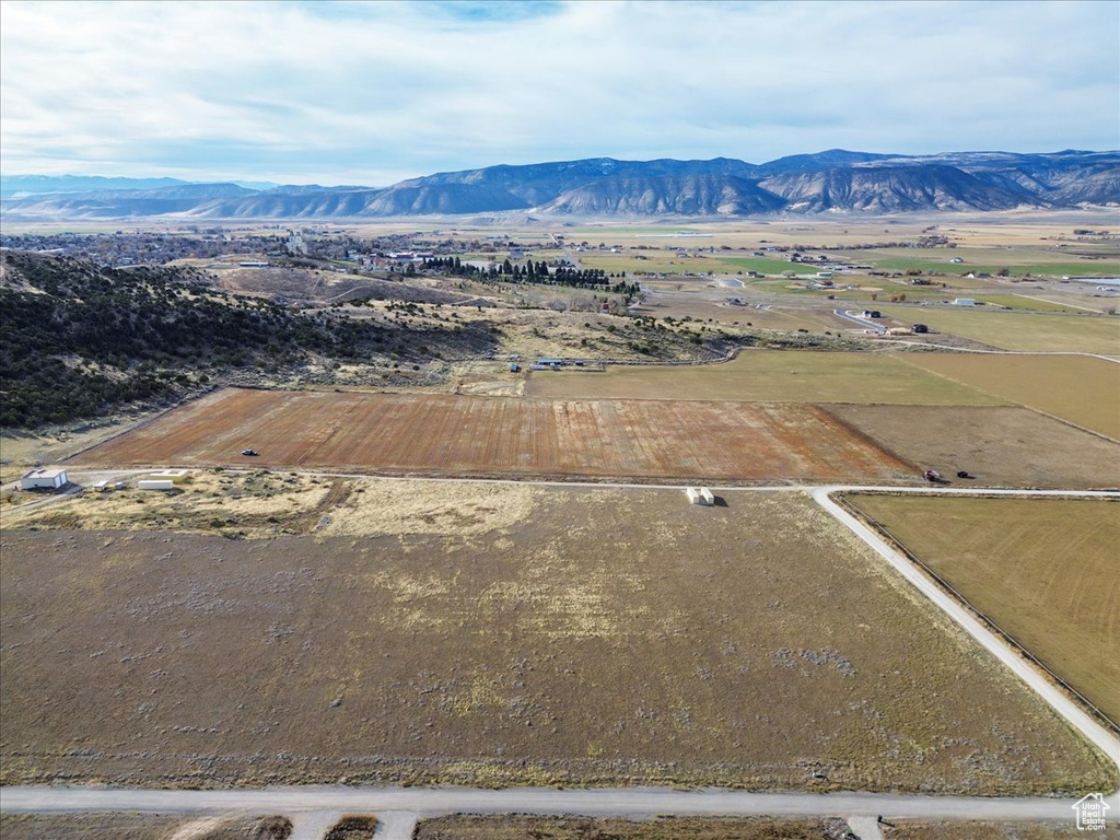 Birds eye view of property with a mountain view and a rural view