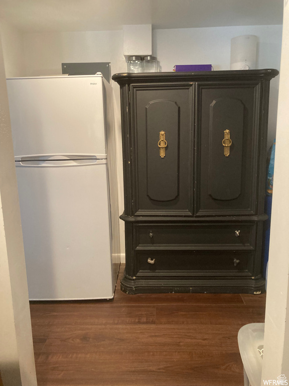 Room details with hardwood / wood-style floors and white refrigerator