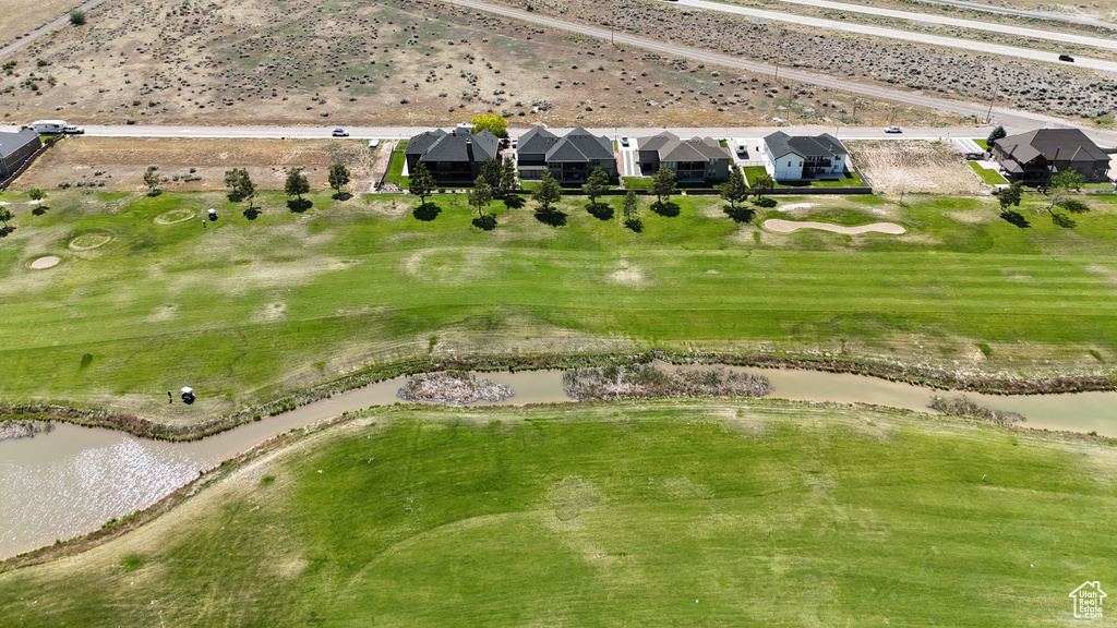 Drone / aerial view of a large body of water and a golf course