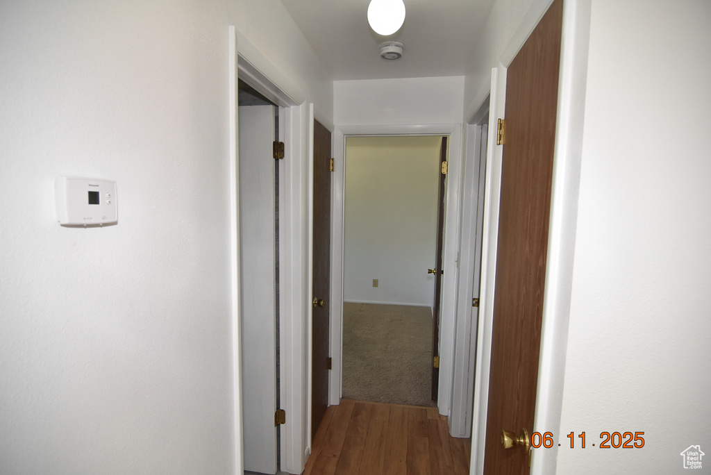 Corridor with wood finished floors