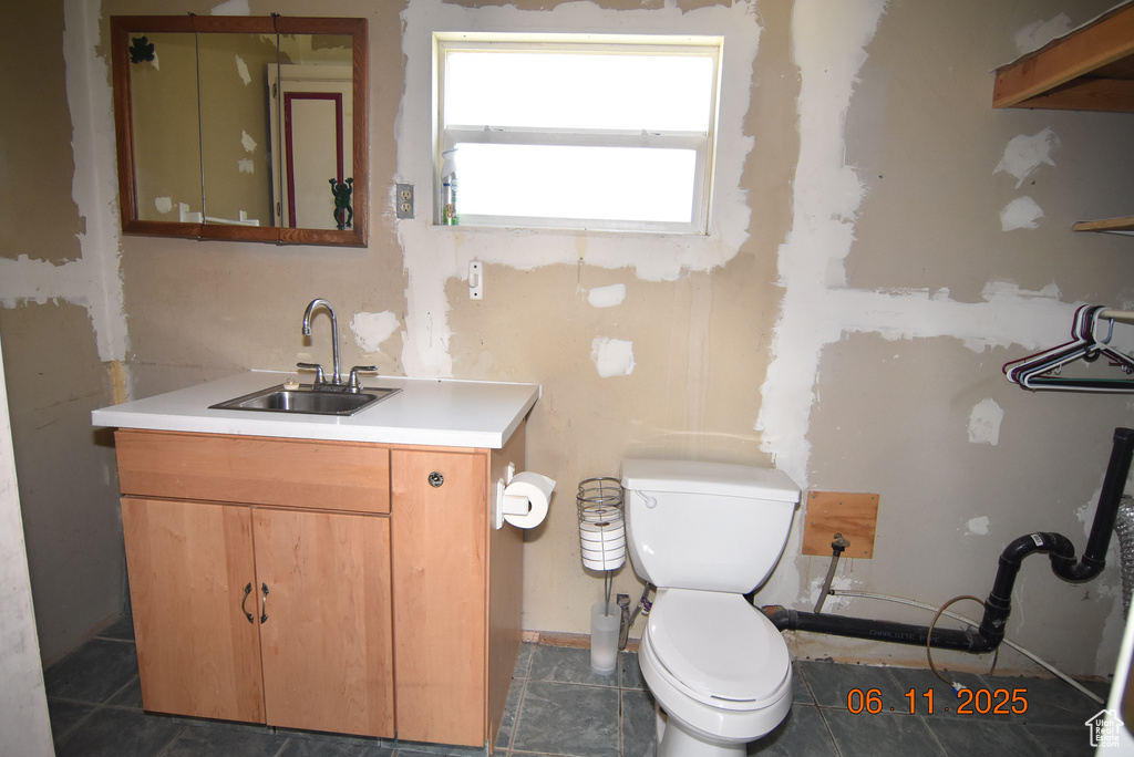 Bathroom with toilet and vanity