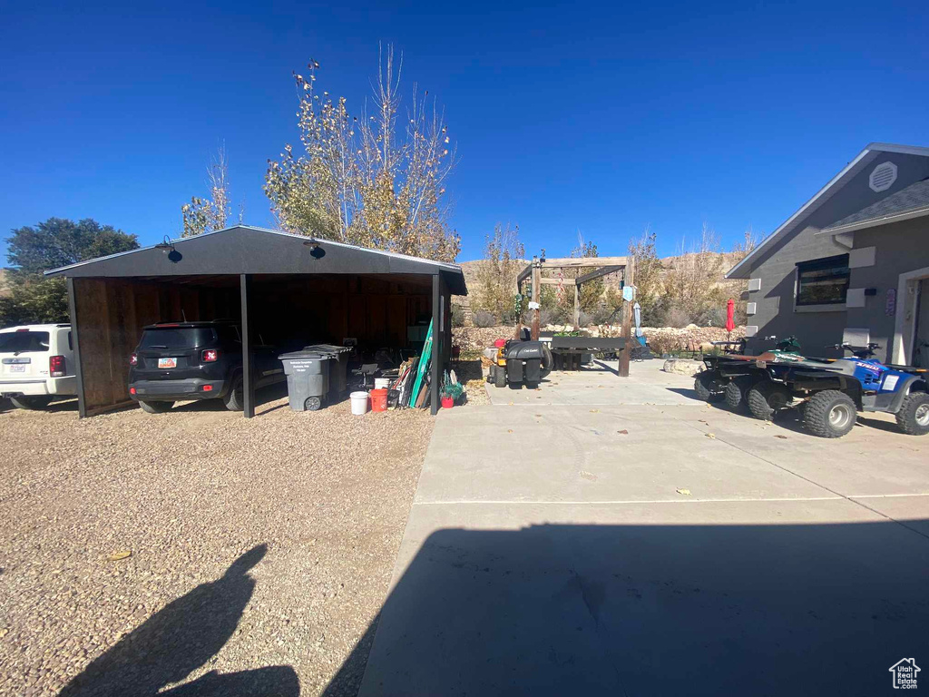 View of car parking featuring a carport