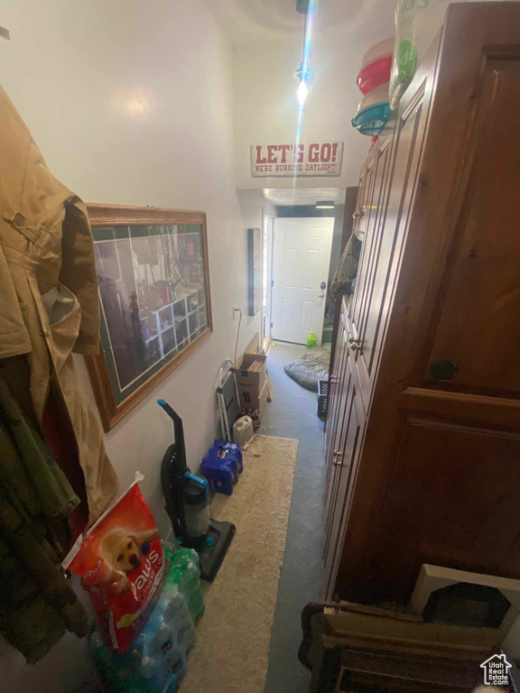 Hallway featuring carpet floors