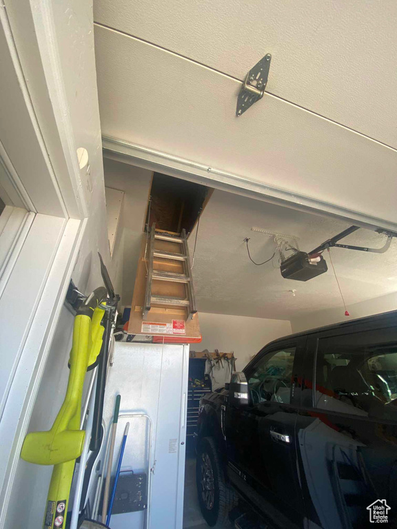 Garage featuring a garage door opener