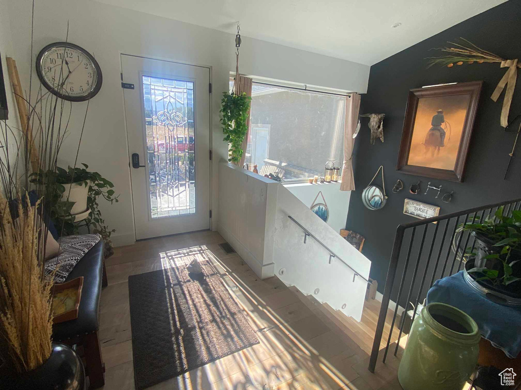 Doorway to outside with light hardwood / wood-style flooring