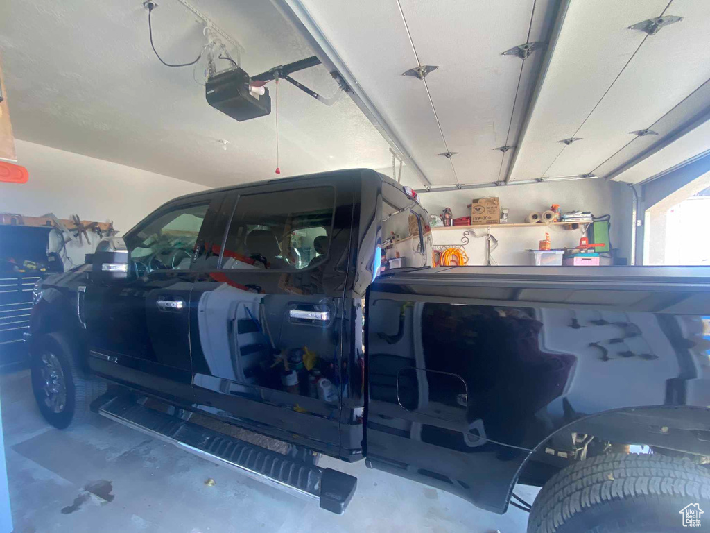 Garage featuring a garage door opener