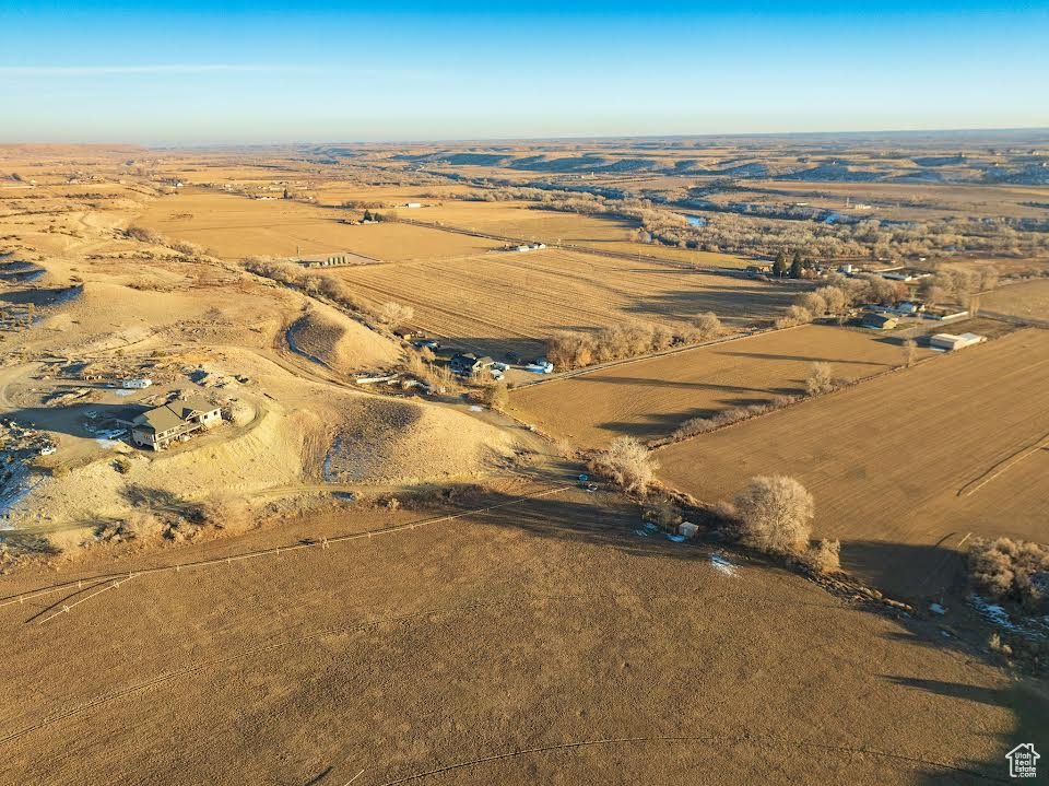 Birds eye view of property featuring a rural view