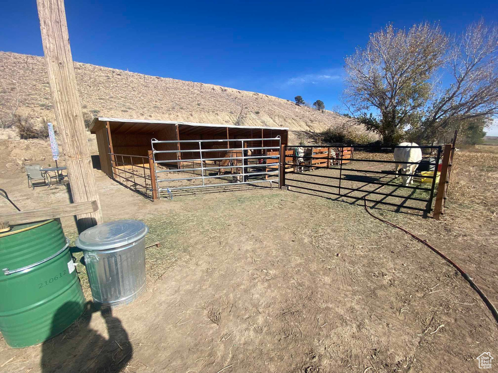 View of stable with a rural view