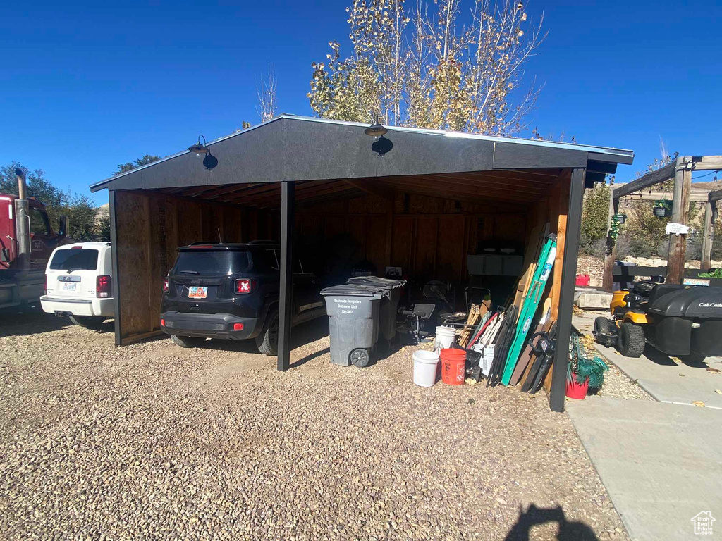 View of outdoor structure featuring a carport