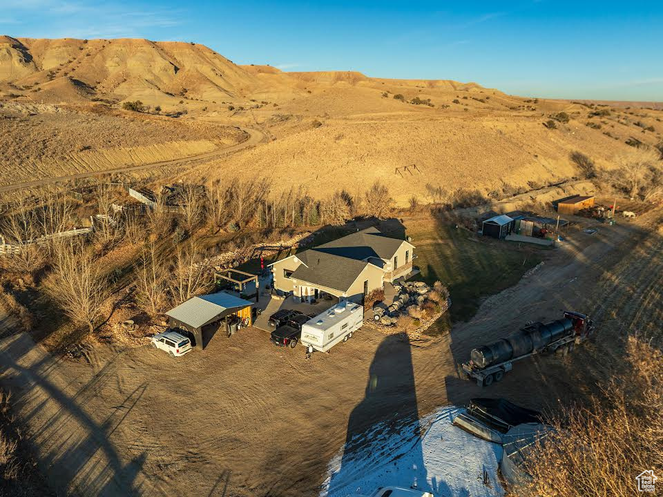 Birds eye view of property with a mountain view