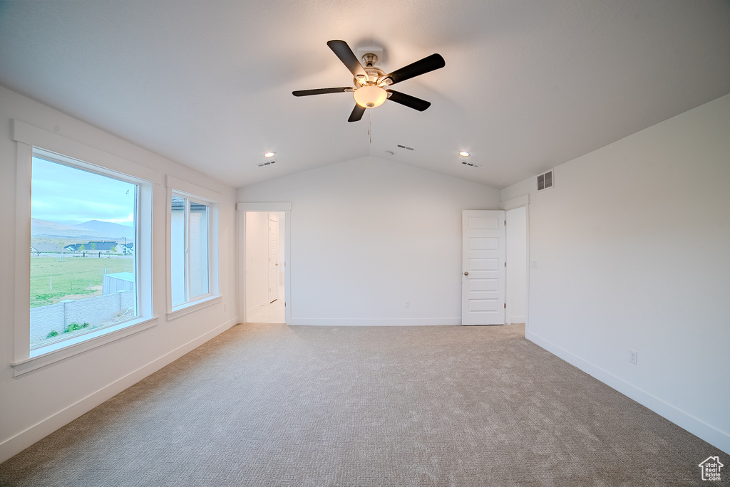 Empty room with ceiling fan, carpet flooring, recessed lighting, and vaulted ceiling