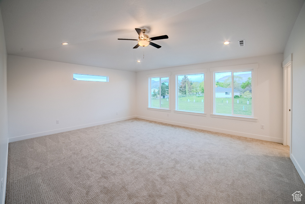 Unfurnished room with baseboards, recessed lighting, ceiling fan, and light colored carpet