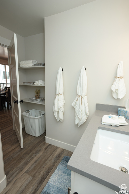 Bathroom featuring hardwood / wood-style floors and vanity