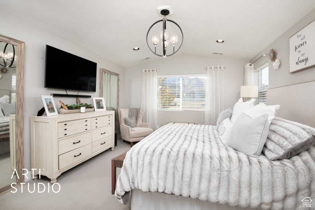 Carpeted bedroom featuring a chandelier, lofted ceiling, and multiple windows