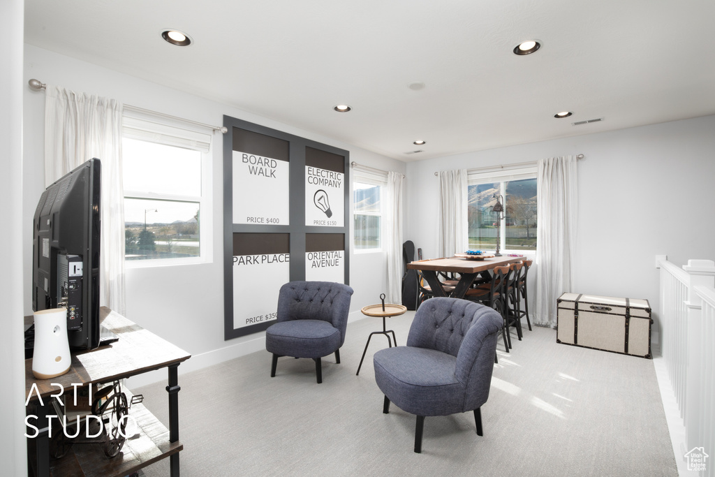 Living area with light colored carpet