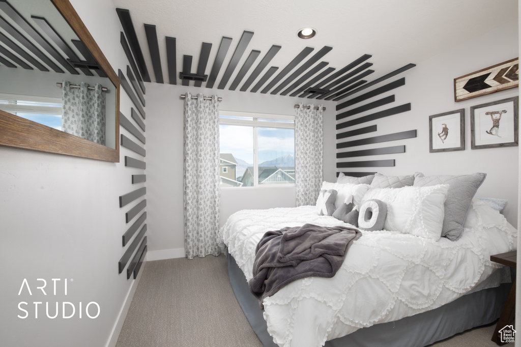 Bedroom featuring light colored carpet