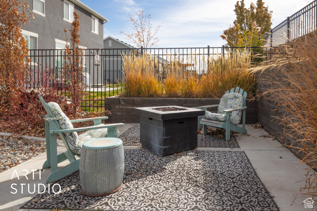 View of patio / terrace with an outdoor fire pit