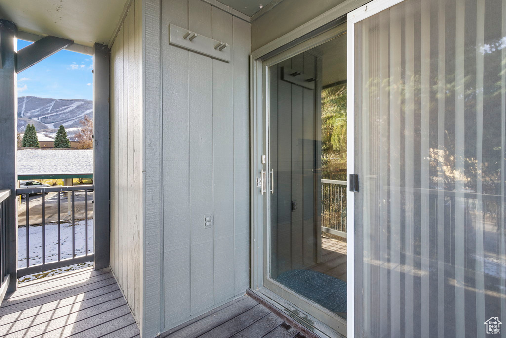 Entrance to property featuring a mountain view and a balcony