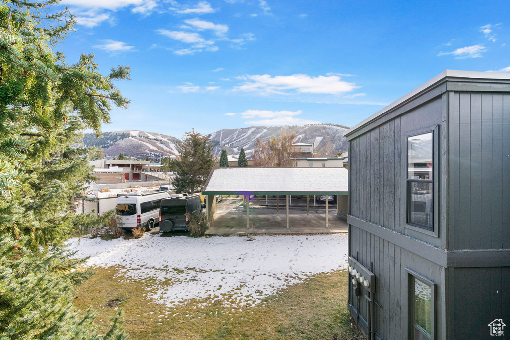 View of yard featuring a carport and a mountain view