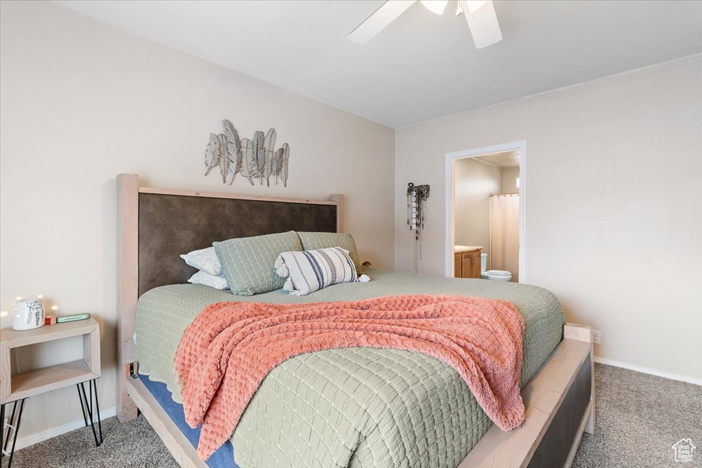 Bedroom featuring carpet, ceiling fan, and ensuite bathroom