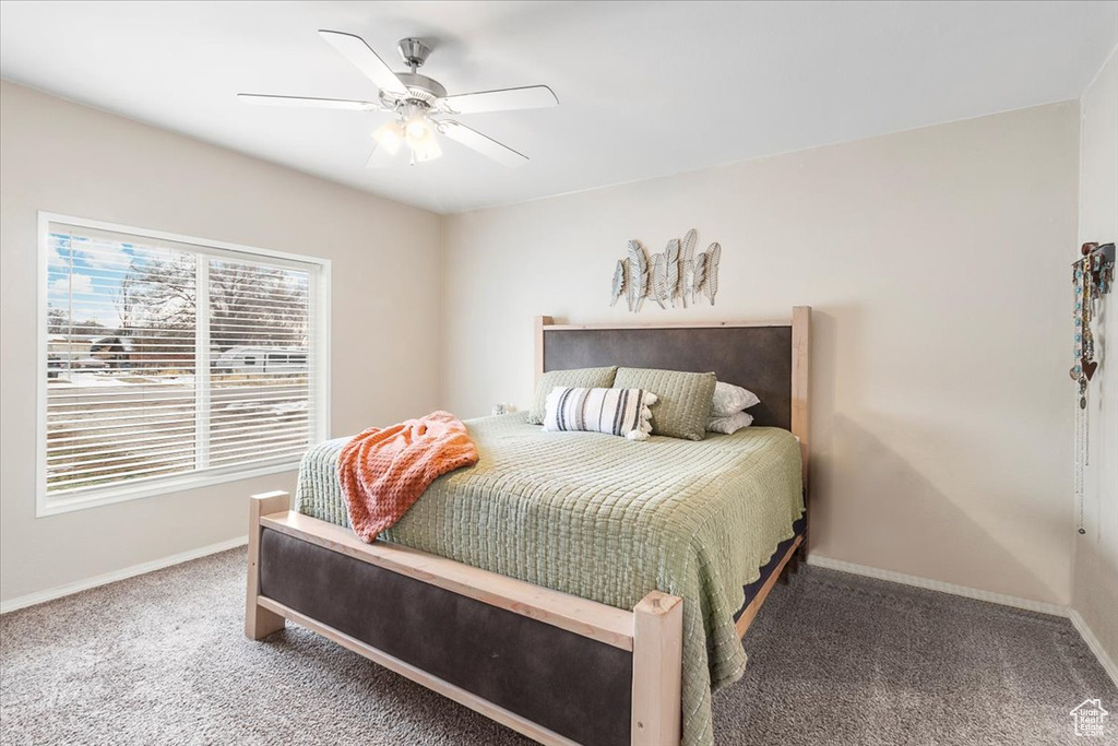 Bedroom with carpet flooring and ceiling fan