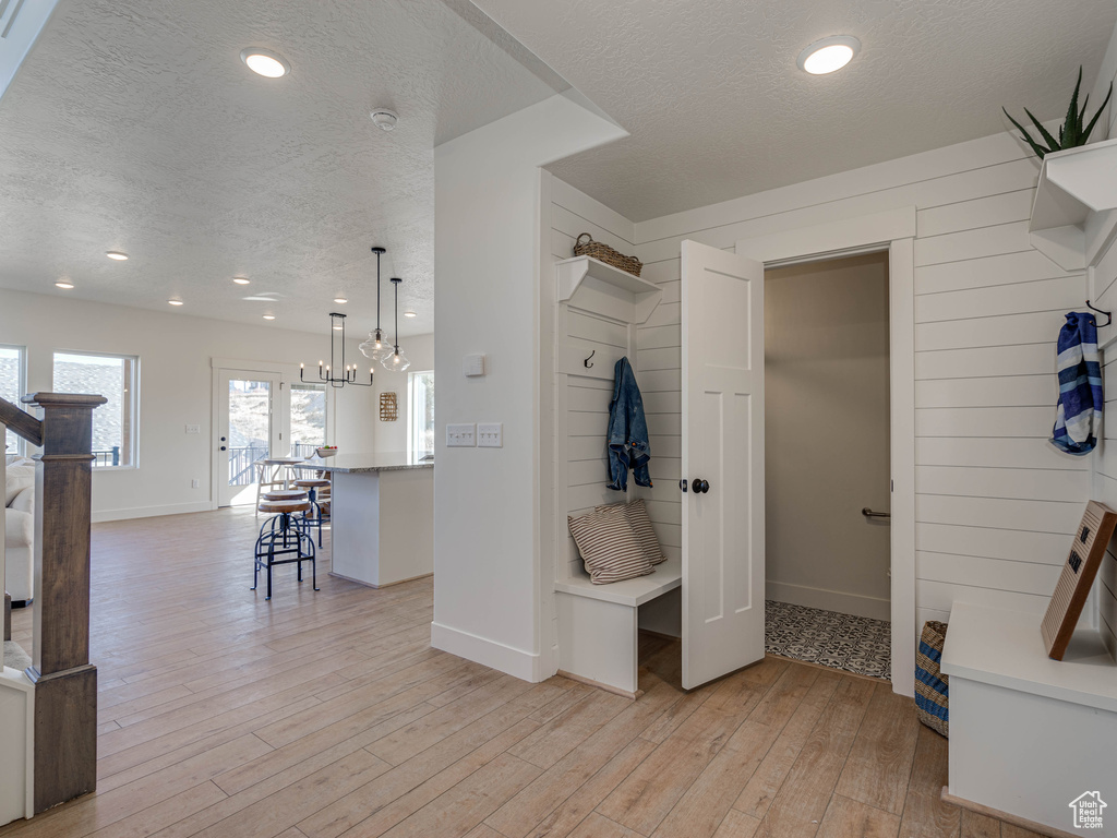 Bathroom featuring hardwood / wood-style floors, a textured ceiling, and recessed lighting
