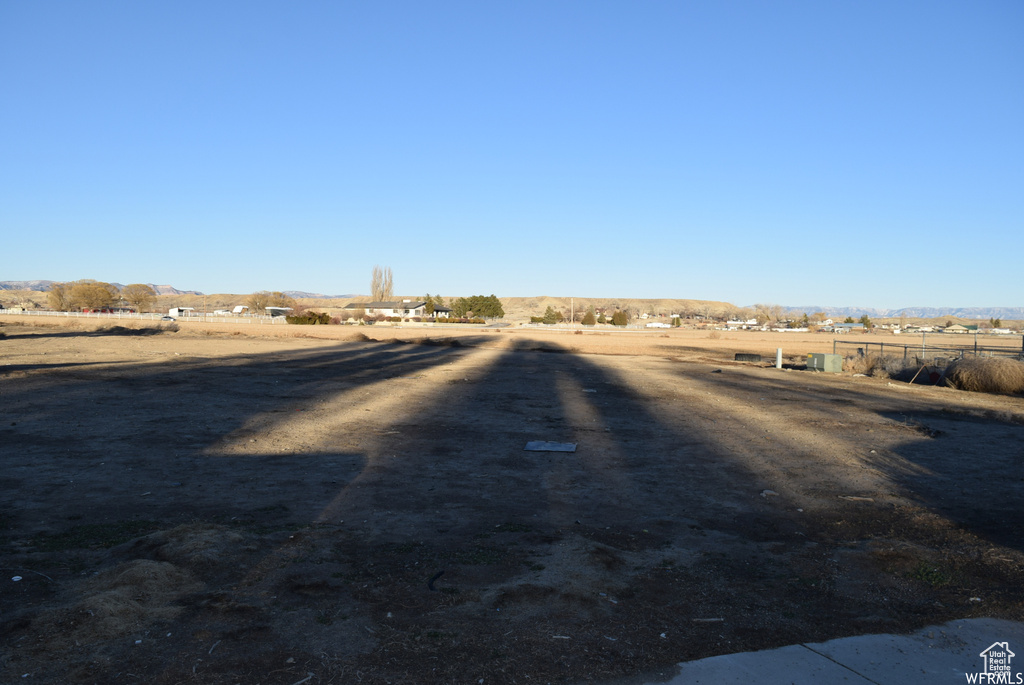 View of yard with a rural view