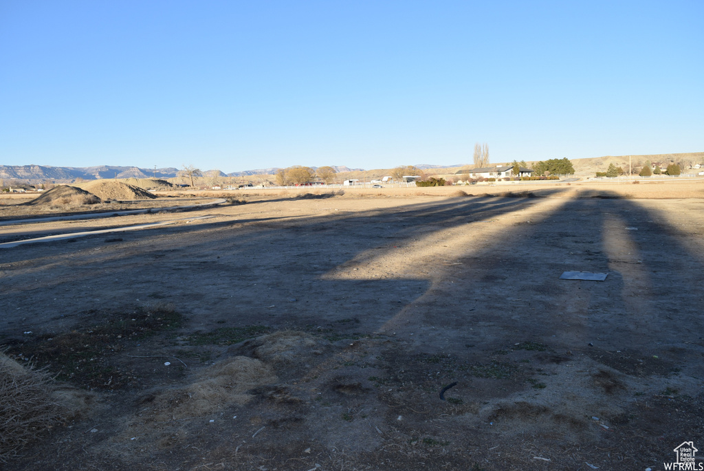 View of yard featuring a mountain view and a rural view