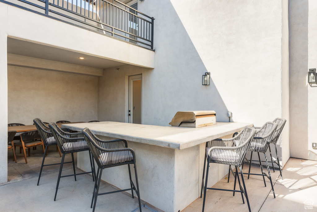 View of patio / terrace with a balcony and an outdoor bar
