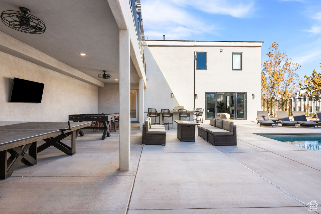 View of patio / terrace with a fenced in pool