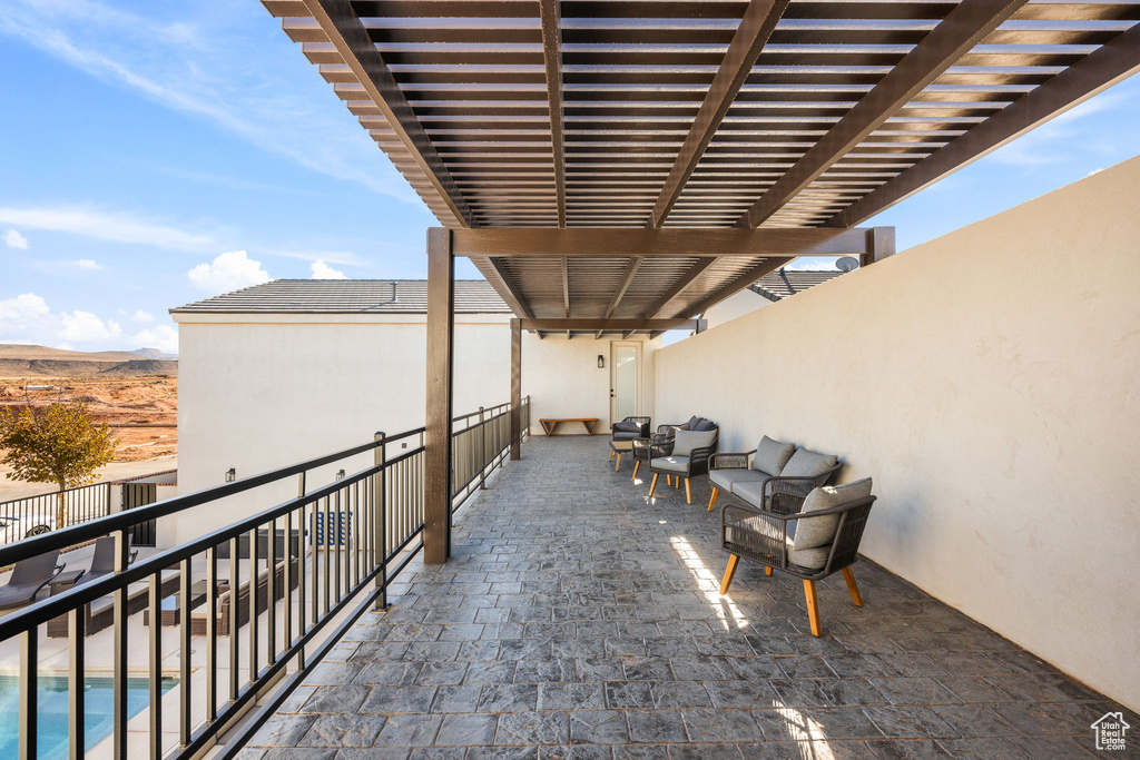 View of patio / terrace with a pergola and a fenced in pool