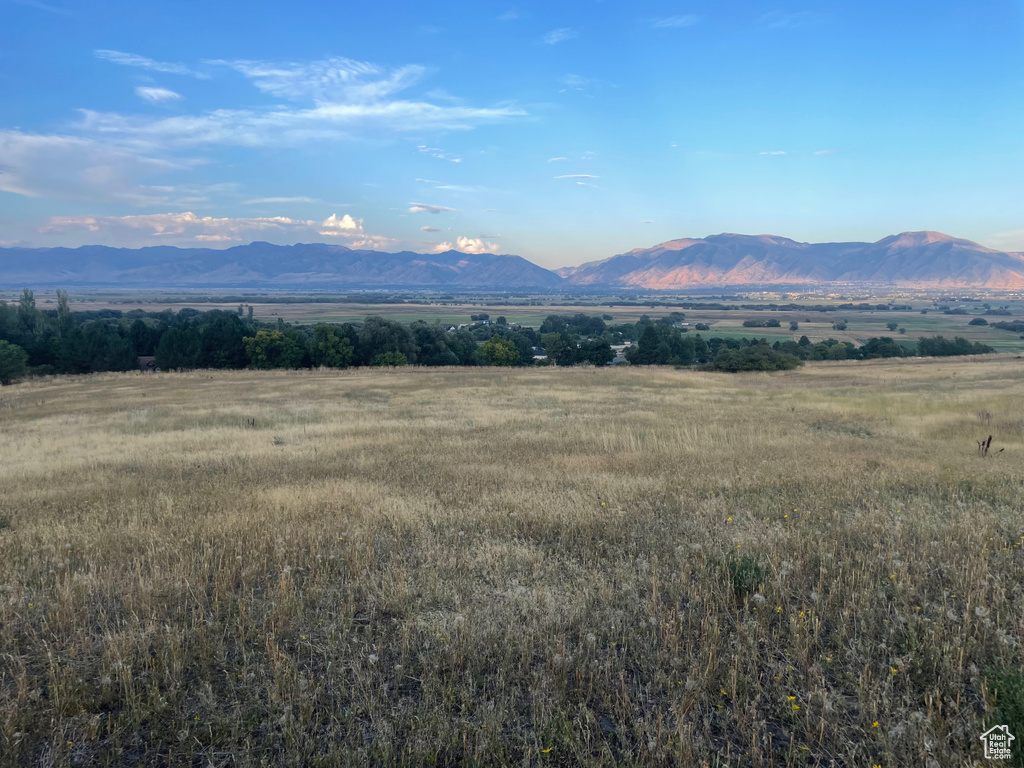 Property view of mountains with a rural view