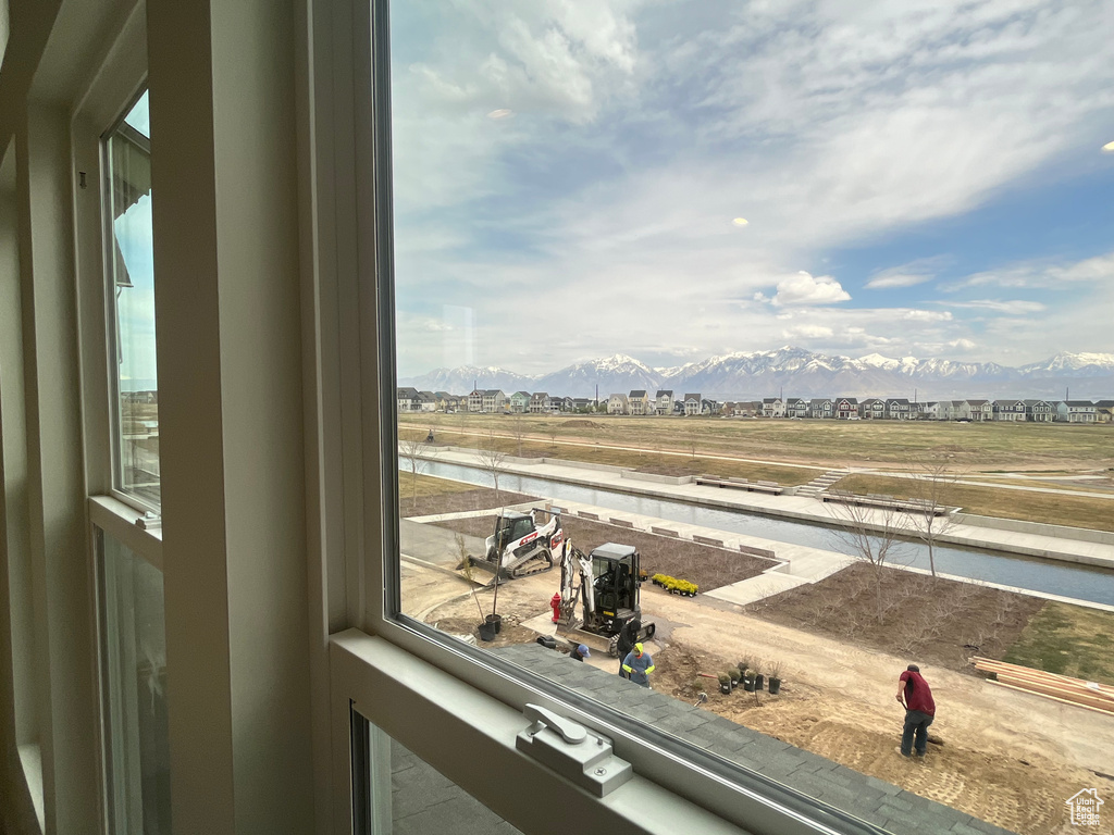 Interior space featuring a water and mountain view