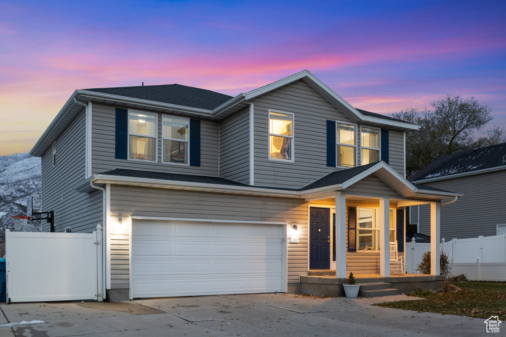 View of property featuring a garage