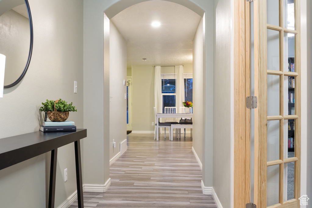 Corridor featuring light hardwood / wood-style flooring