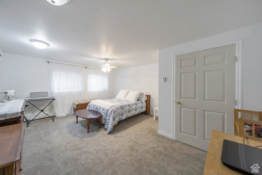 Bedroom featuring carpet floors and ceiling fan