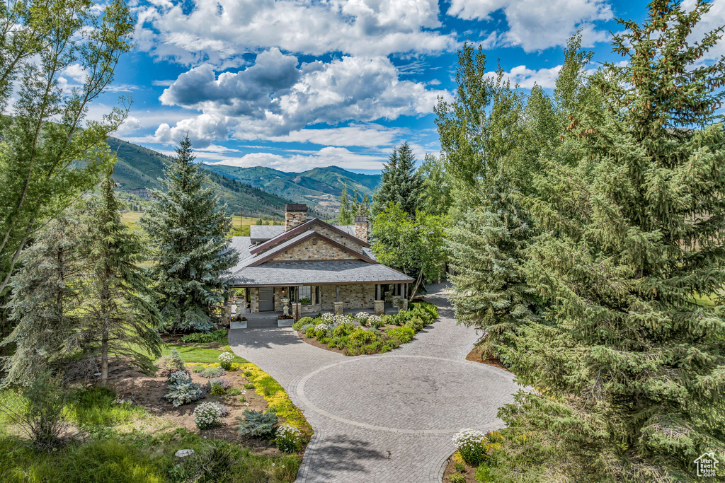 View of front facade featuring a mountain view and a porch