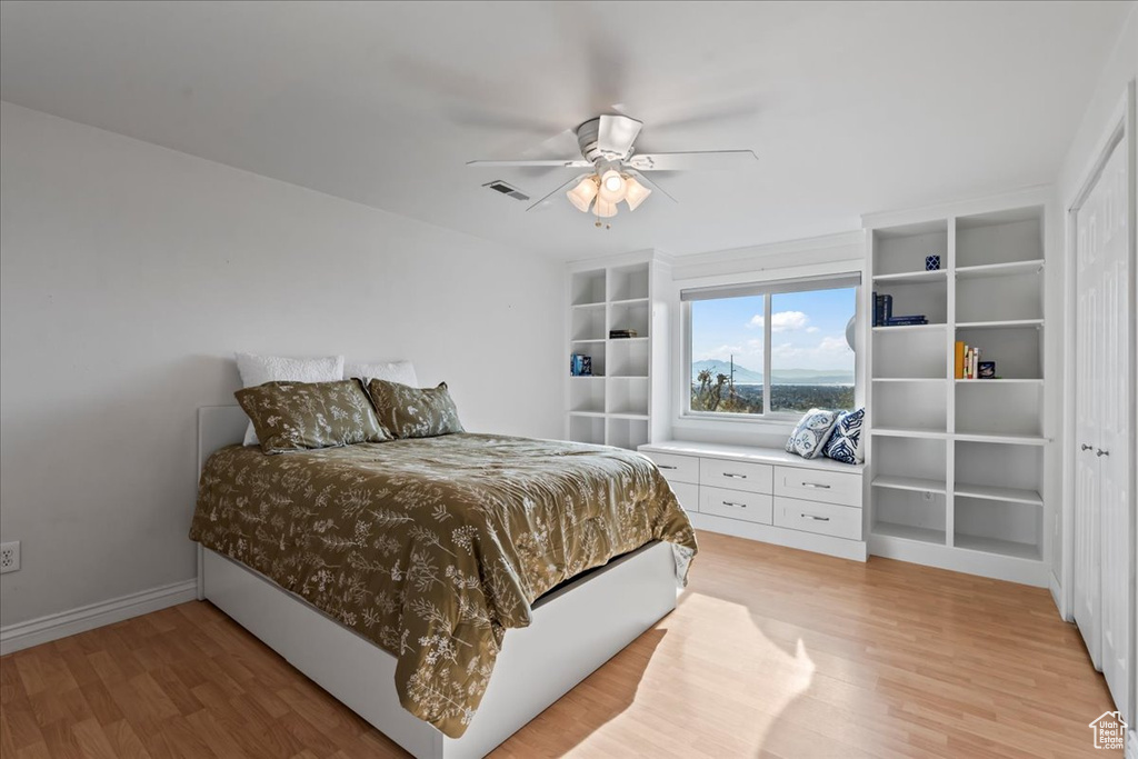 Bedroom featuring ceiling fan and light wood-type flooring