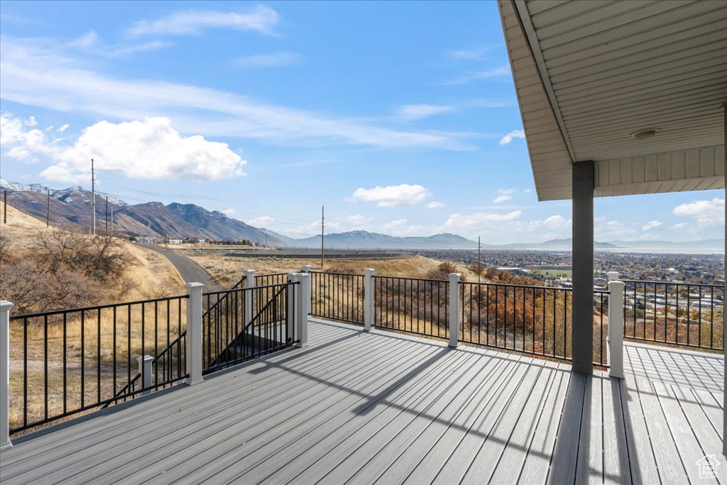 Wooden deck featuring a mountain view