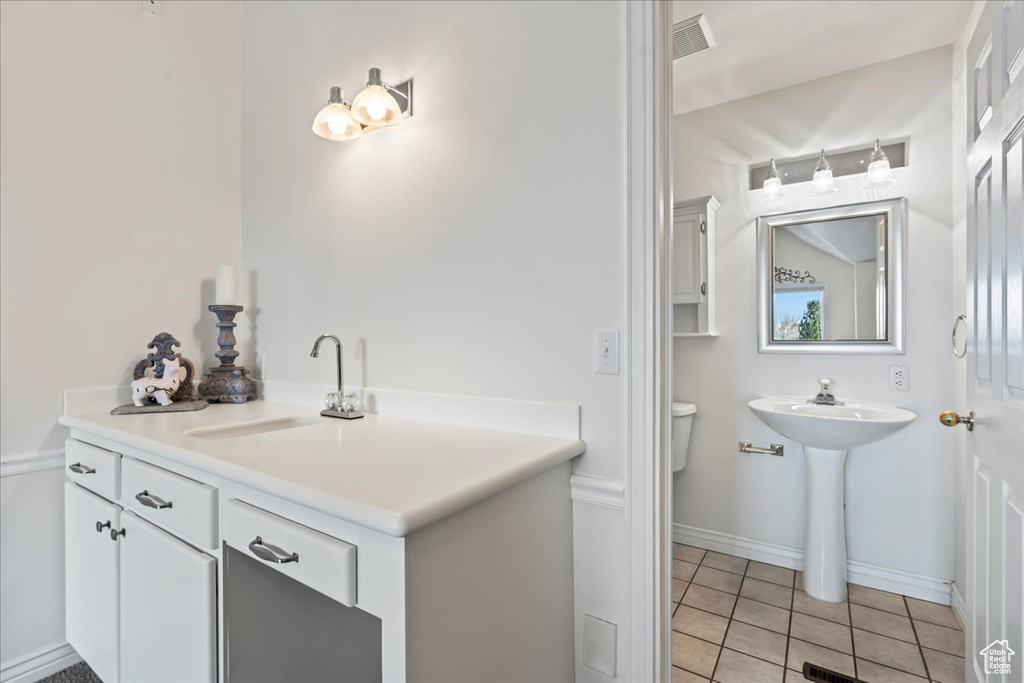 Bathroom with tile patterned floors and sink