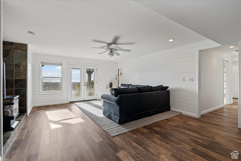 Living room featuring french doors, dark hardwood / wood-style floors, and ceiling fan