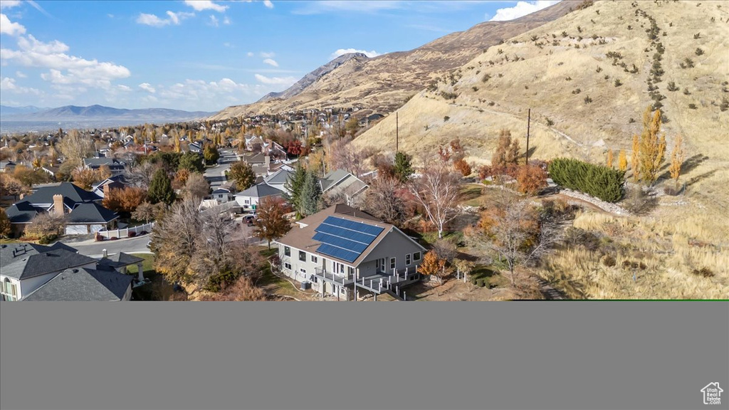 Birds eye view of property featuring a mountain view