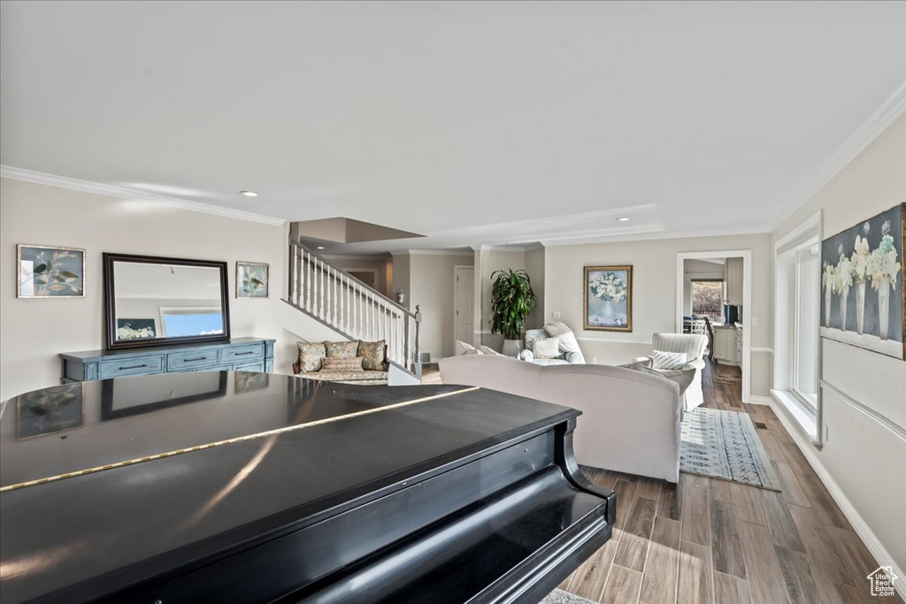 Interior space featuring hardwood / wood-style floors and ornamental molding